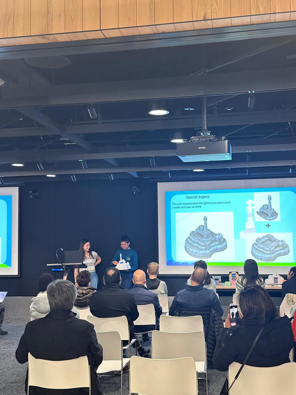 CurioLab mentors working with students at a session