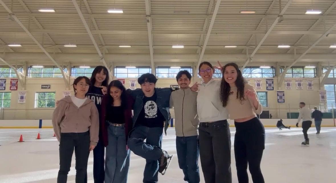 CurioLab mentors working with students