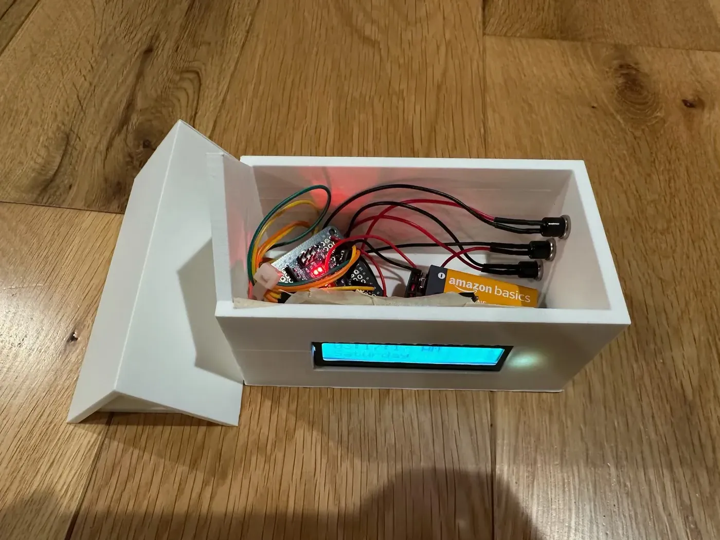 The wiring and microcontroller inside a student's alarm clock
